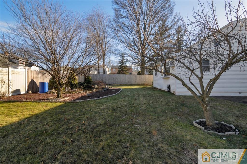 136 McFarlane Road Colonia, NJ 07067 - Photo 21 of 23 a view of a yard with a tree