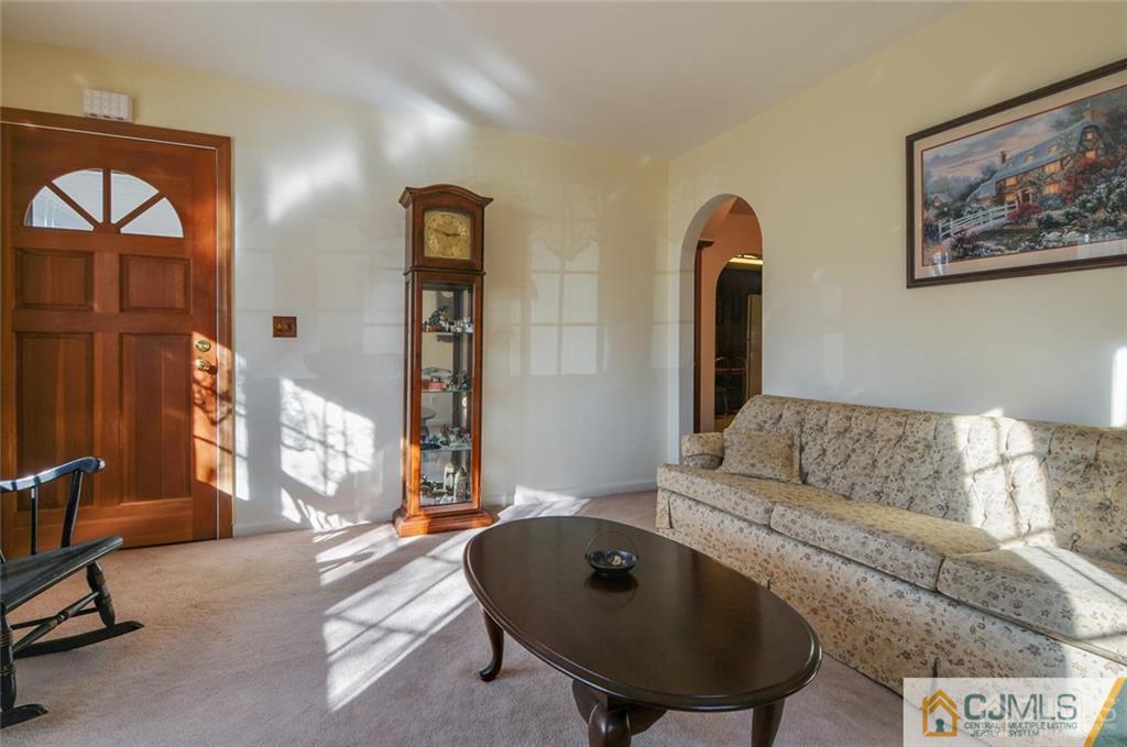 136 McFarlane Road Colonia, NJ 07067 - Photo 5 of 23 a living room with furniture and a painting