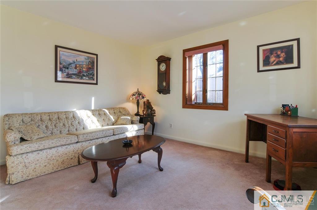 136 McFarlane Road Colonia, NJ 07067 - Photo 6 of 23 a living room with furniture and a window