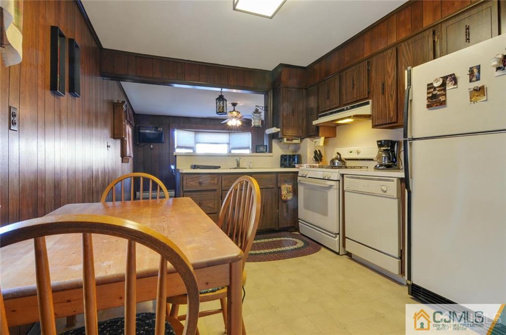 136 McFarlane Road Colonia, NJ 07067 - Photo 10 of 23 a kitchen with sink a refrigerator and cabinets