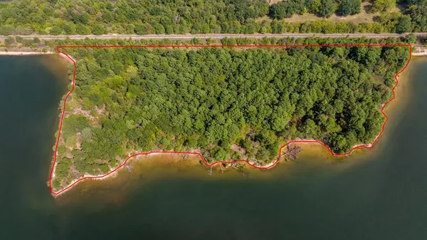 a view of a lake with a yard