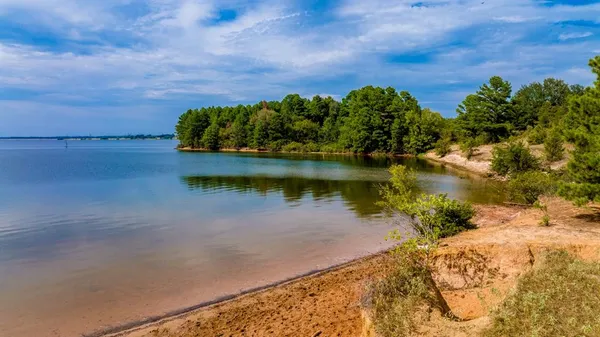 a view of a lake with a yard