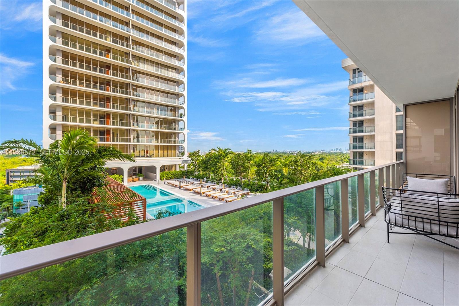 2655 South Bayshore Drive, Unit 909 Miami, FL 33133 - Photo 12 of 26 a view of balcony with wooden floor and fence