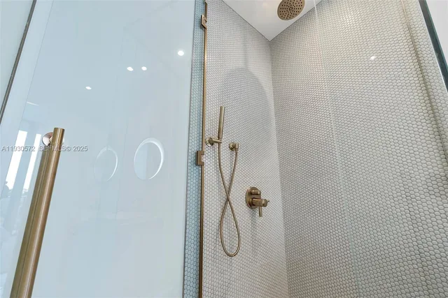 a bedroom with a large bed and a large window