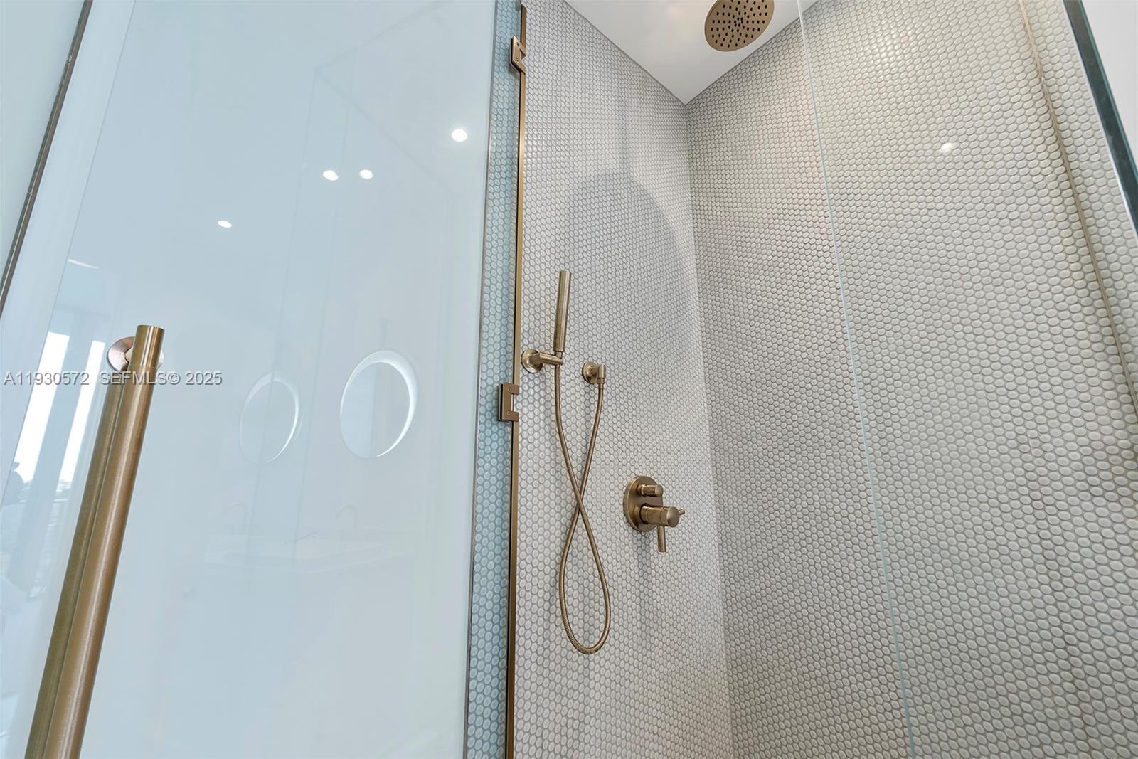 2655 South Bayshore Drive, Unit 909 Miami, FL 33133 - Photo 16 of 26 a bathroom with a shower