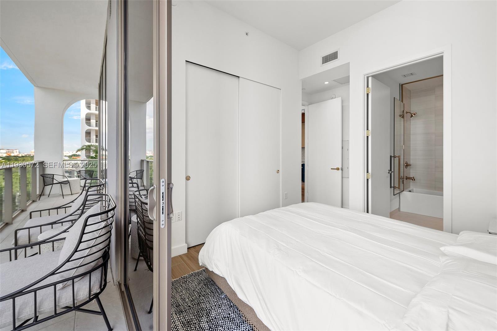 2655 South Bayshore Drive, Unit 909 Miami, FL 33133 - Photo 19 of 26 a bathroom with a shower and a sink