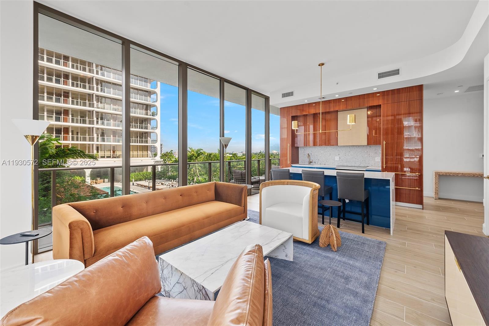 2655 South Bayshore Drive, Unit 909 Miami, FL 33133 - Photo 3 of 26 a living room with furniture and a large window