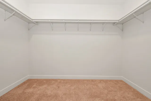 a view of an empty walk in closet
