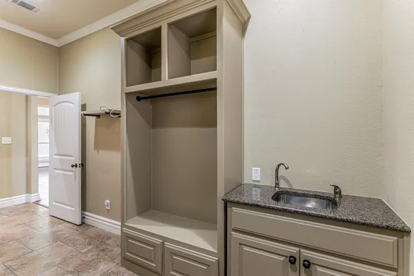 a bathroom with a granite countertop sink and mirror