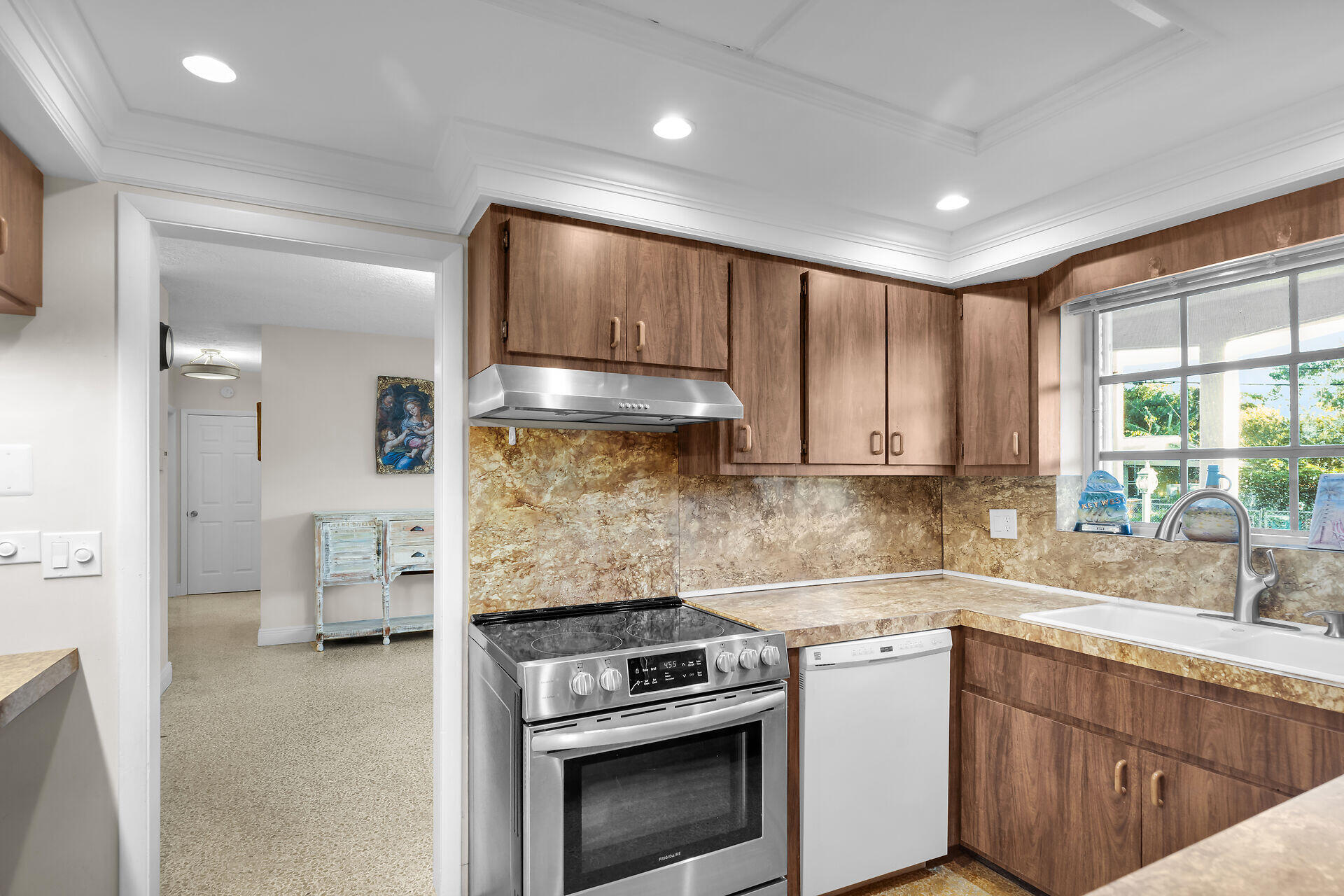 2801 Fogarty Avenue Key West, FL 33040 - Photo 28 of 53 a kitchen with a stove a sink and a refrigerator
