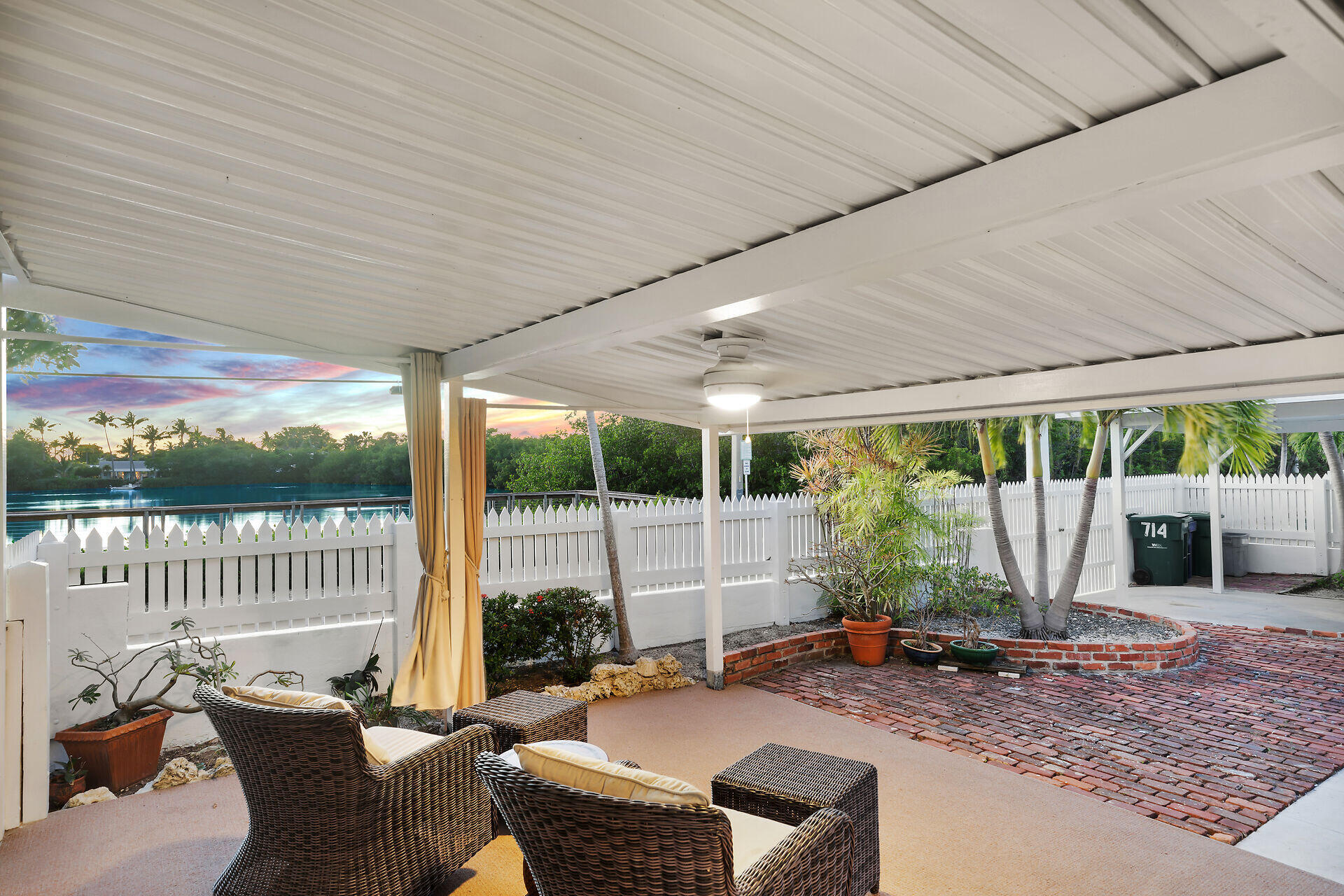 2801 Fogarty Avenue Key West, FL 33040 - Photo 45 of 53 a view of a patio with a table chairs and a backyard