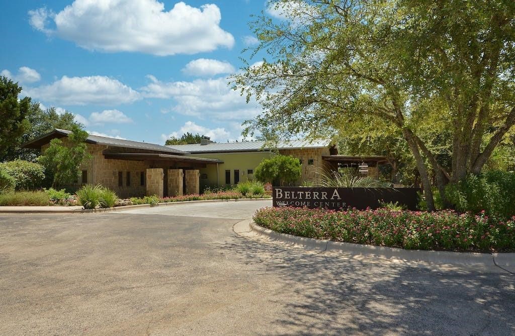 137 Nantucket Circle Austin, TX 78737 - Photo 26 of 34 a front view of house with a garden