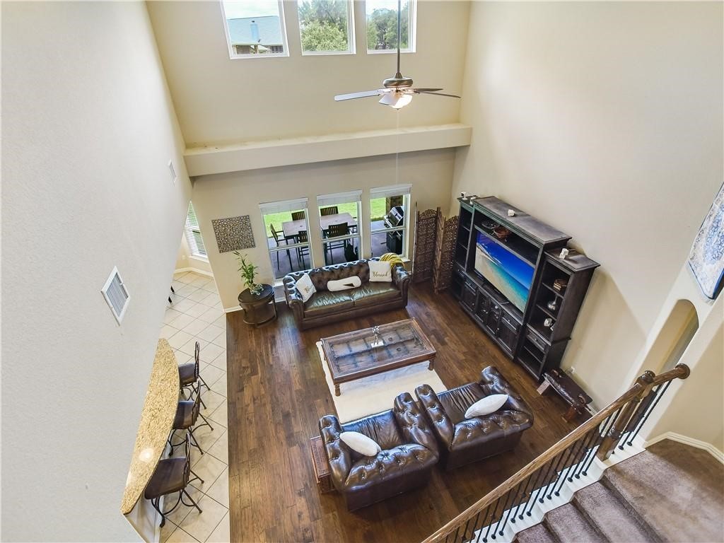 137 Nantucket Circle Austin, TX 78737 - Photo 7 of 34 a living room with furniture and a wooden floor