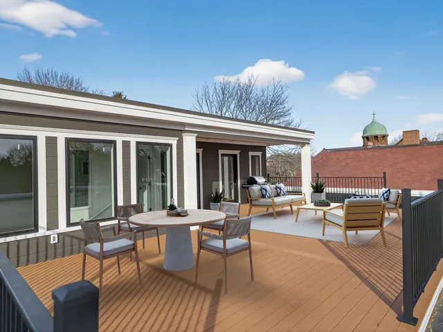 a view of swimming pool with wooden floor