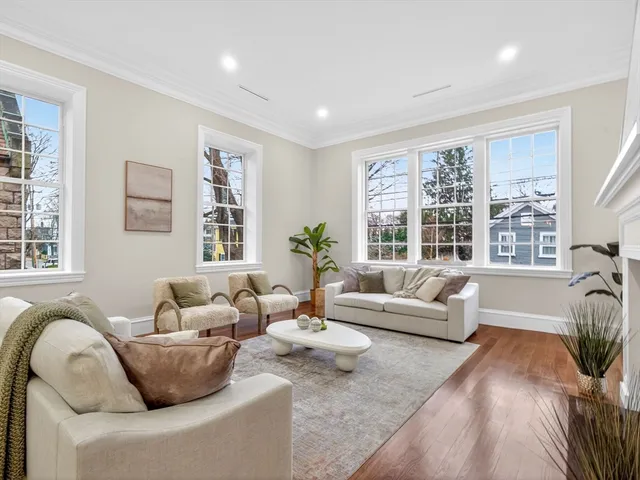 a living room with furniture and windows