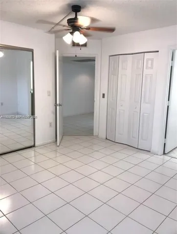 a view of a bathroom with a sink and a mirror
