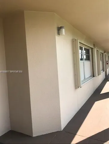 a view of a hallway with front door