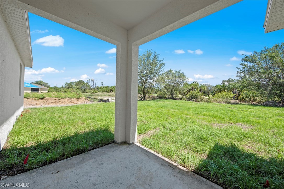 367 Ranier Avenue Lehigh Acres, FL 33974 - Photo 23 of 24 a view of a garden from a window