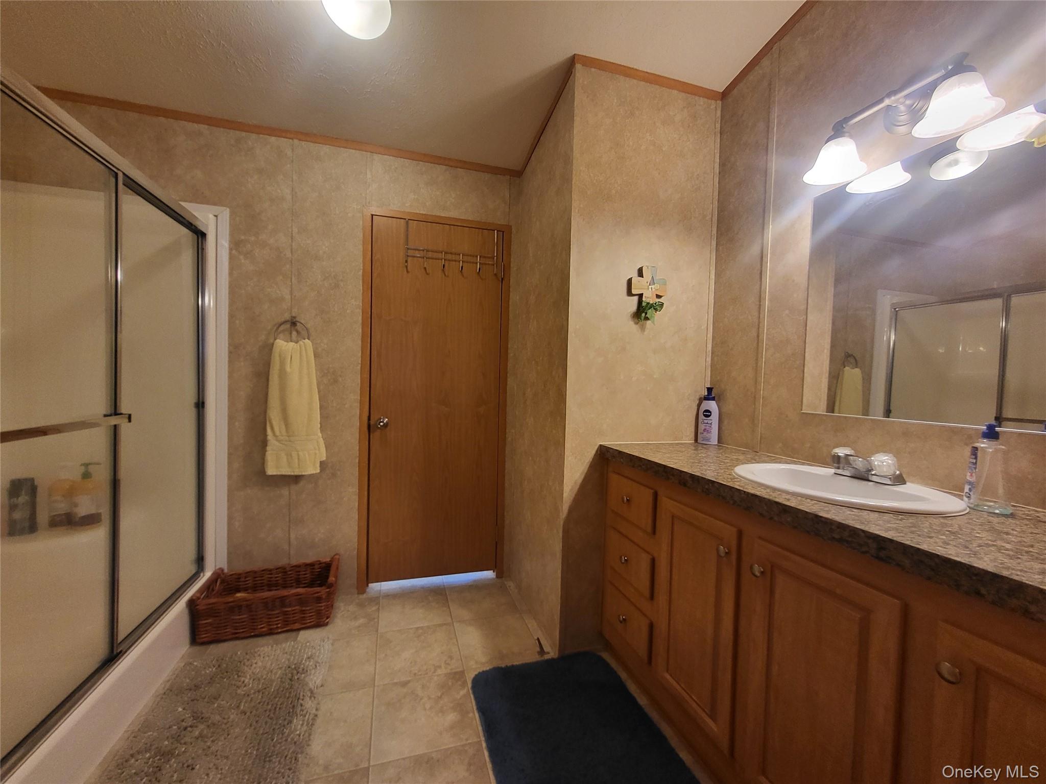 308 William Brown Road Fremont, NY 12741 - Photo 19 of 33 a bathroom with a double vanity sink a toilet and shower