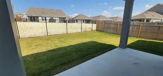 a view of outdoor space and backyard