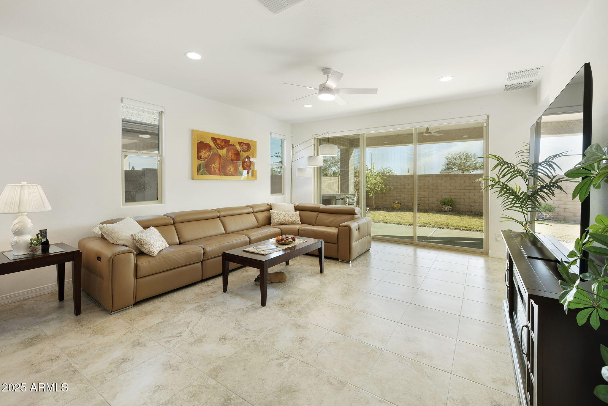 5823 South Del Rancho Mesa, AZ 85212 - Photo 17 of 67 a living room with furniture and a large window