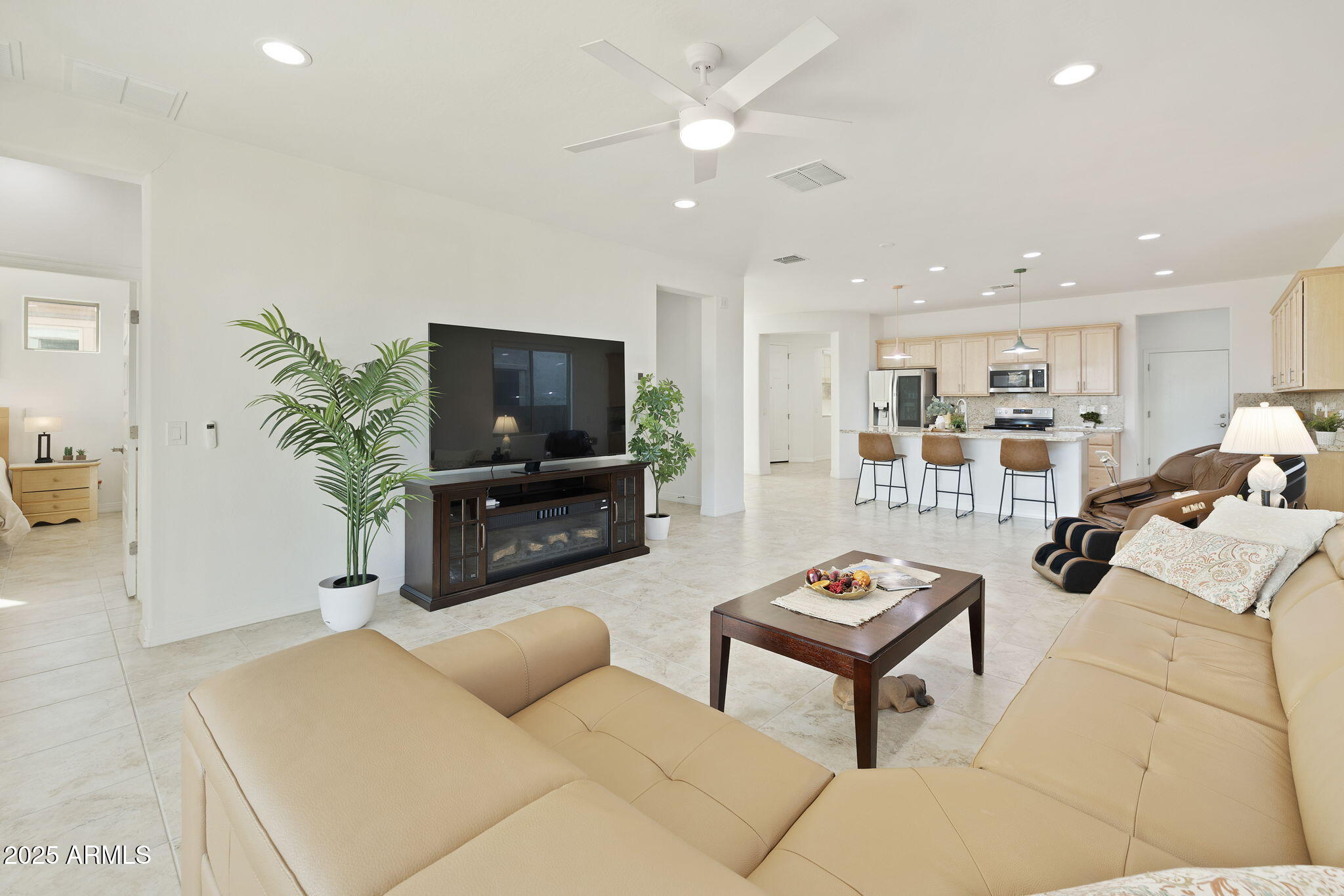 5823 South Del Rancho Mesa, AZ 85212 - Photo 21 of 67 a living room with furniture and a flat screen tv