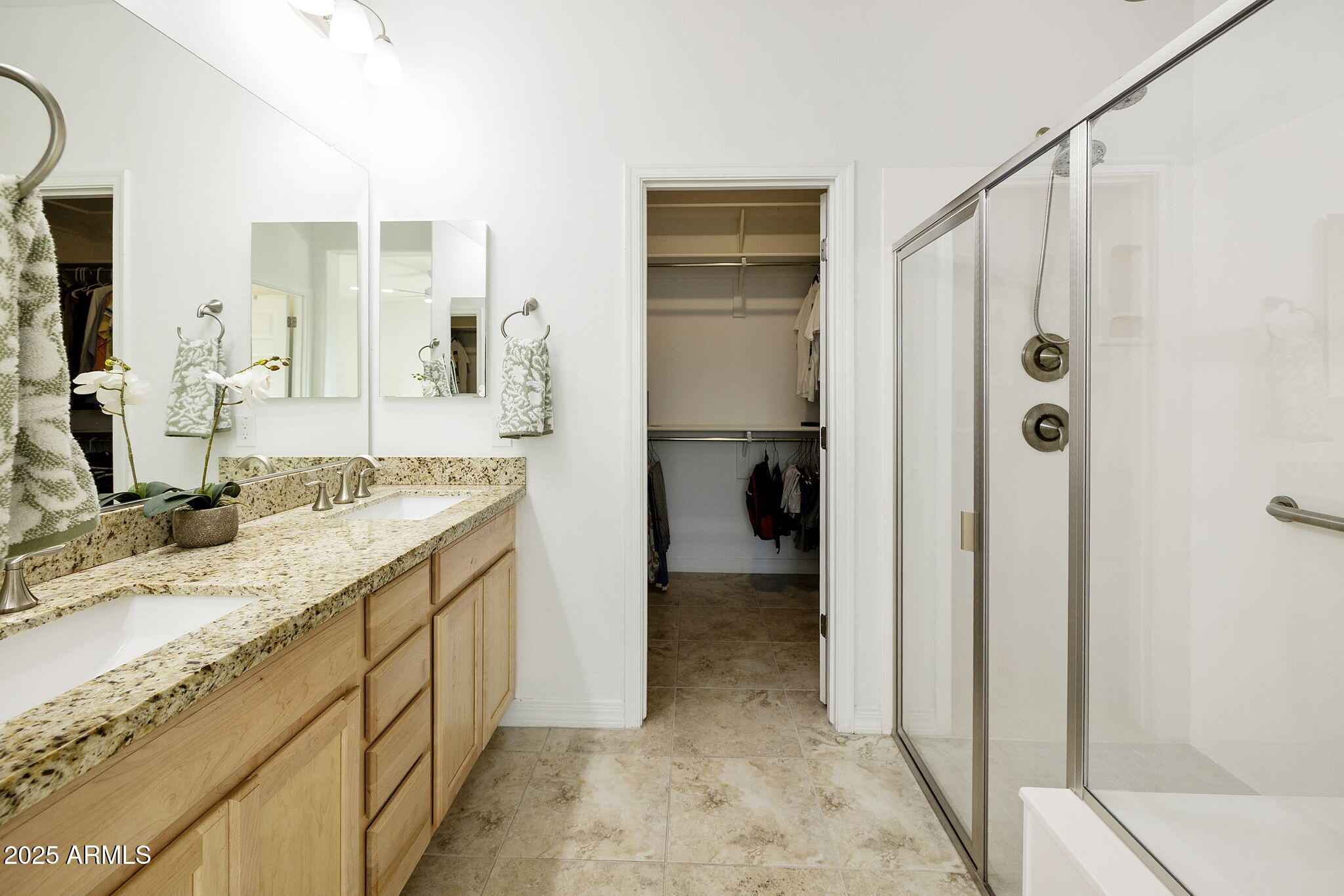 5823 South Del Rancho Mesa, AZ 85212 - Photo 29 of 67 a bathroom with a granite countertop sink a mirror and shower