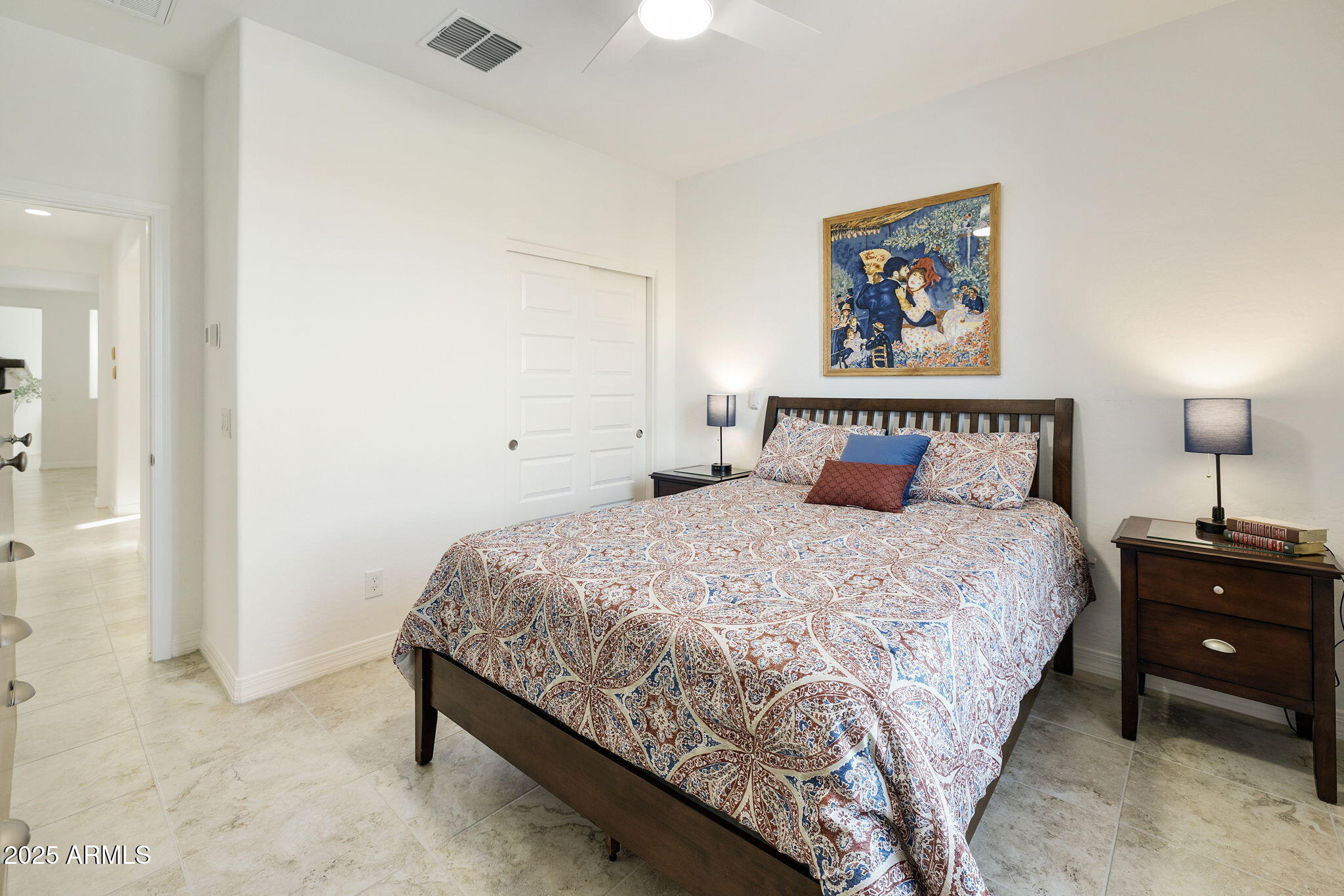 5823 South Del Rancho Mesa, AZ 85212 - Photo 37 of 67 a bedroom with a bed and a painting on the wall