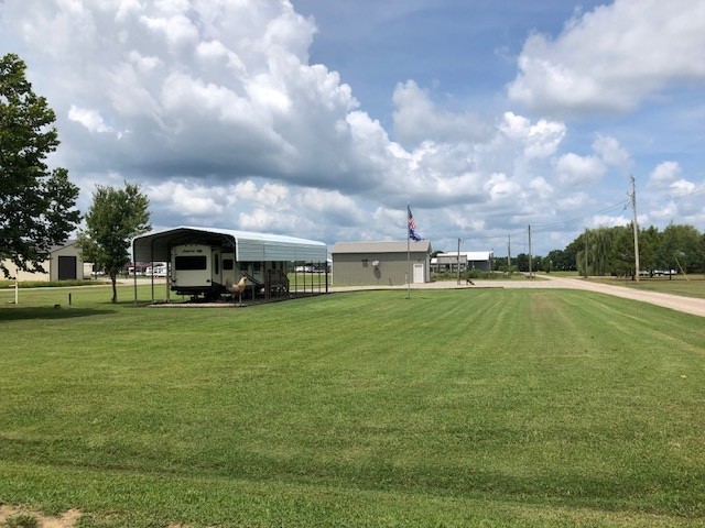 a view of a house with a big yard