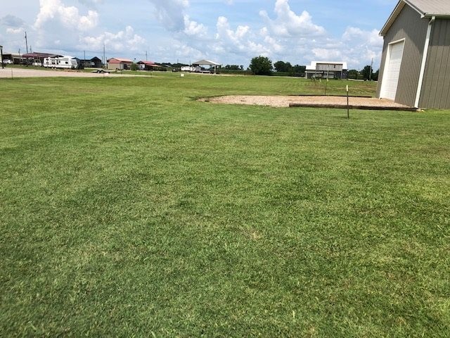 0 Ali Grace Lane Adamsville, TN 38310 - Photo 11 of 11 a view of a golf course with a lake