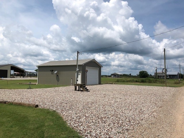 0 Ali Grace Lane Adamsville, TN 38310 - Photo 6 of 11 a front view of a house with a yard and garage