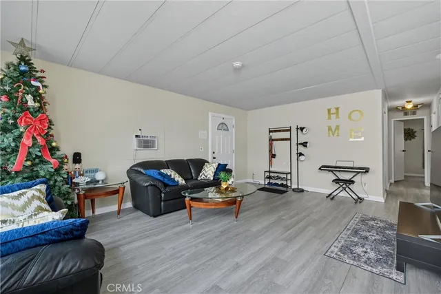 a living room with furniture and flowers