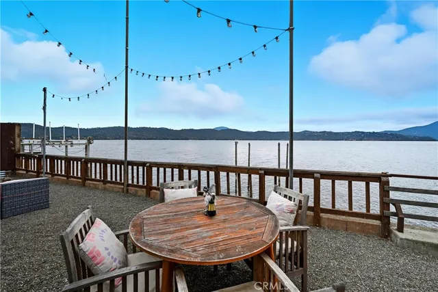 a balcony with table and chairs