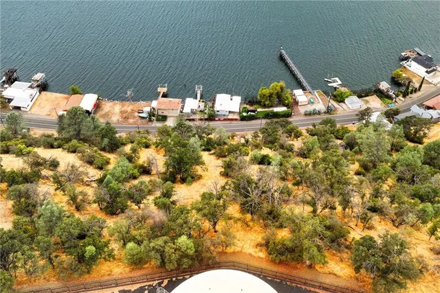 an aerial view of a houses with city view