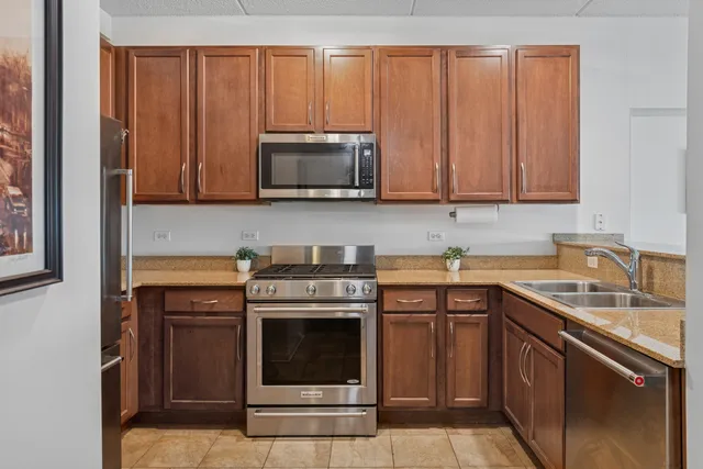 a kitchen with a sink stove and microwave