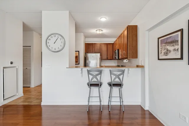 a view of kitchen with cabinets and wooden floor