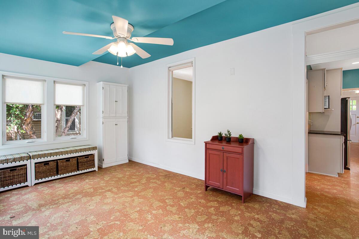 409 Woodford Road Baltimore, MD 21212 - Photo 20 of 49 Sunroom with peek through to dining room