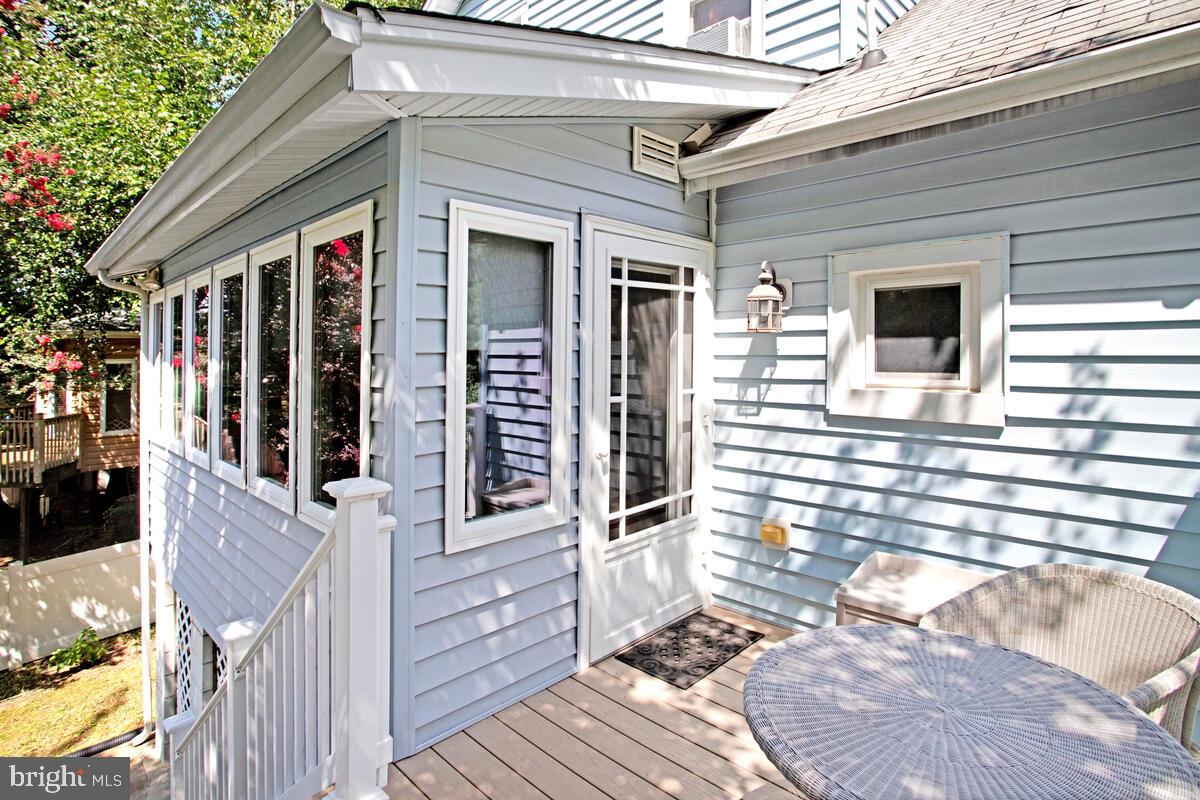 409 Woodford Road Baltimore, MD 21212 - Photo 22 of 49 Private deck off sunroom leads to the yard