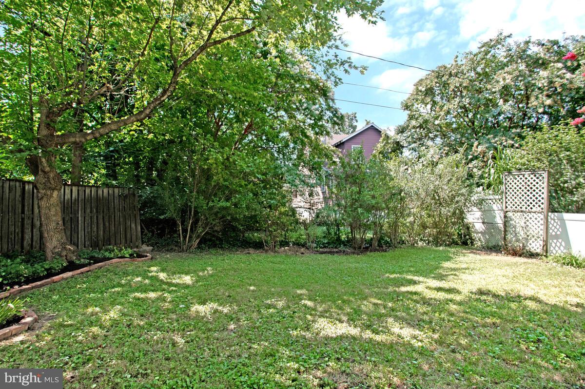409 Woodford Road Baltimore, MD 21212 - Photo 40 of 49 Landscaped backyard with privacy fencing