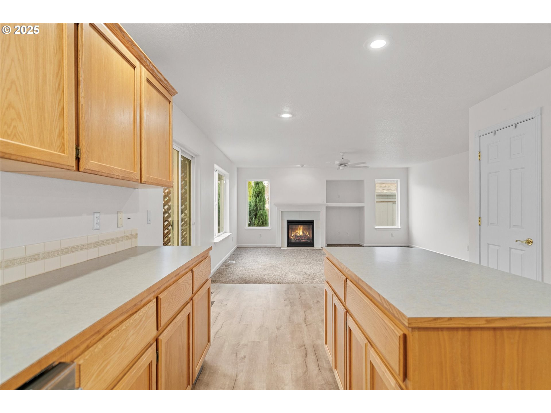 12262 Southwest 114th Terrace Portland, OR 97223 - Photo 13 of 41 a kitchen with kitchen island a sink stove and refrigerator