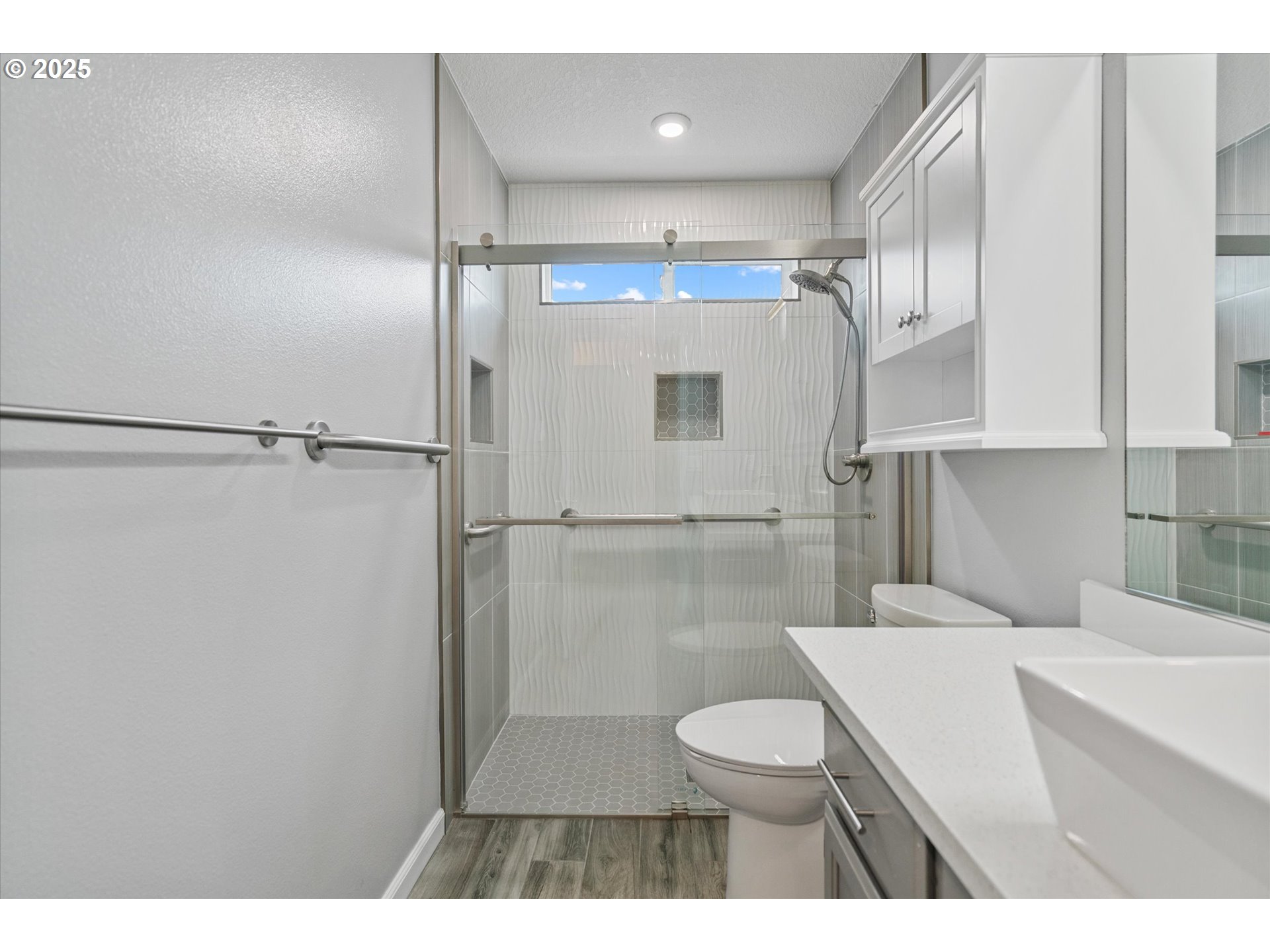 12262 Southwest 114th Terrace Portland, OR 97223 - Photo 20 of 41 a bathroom with a sink toilet a mirror and shower
