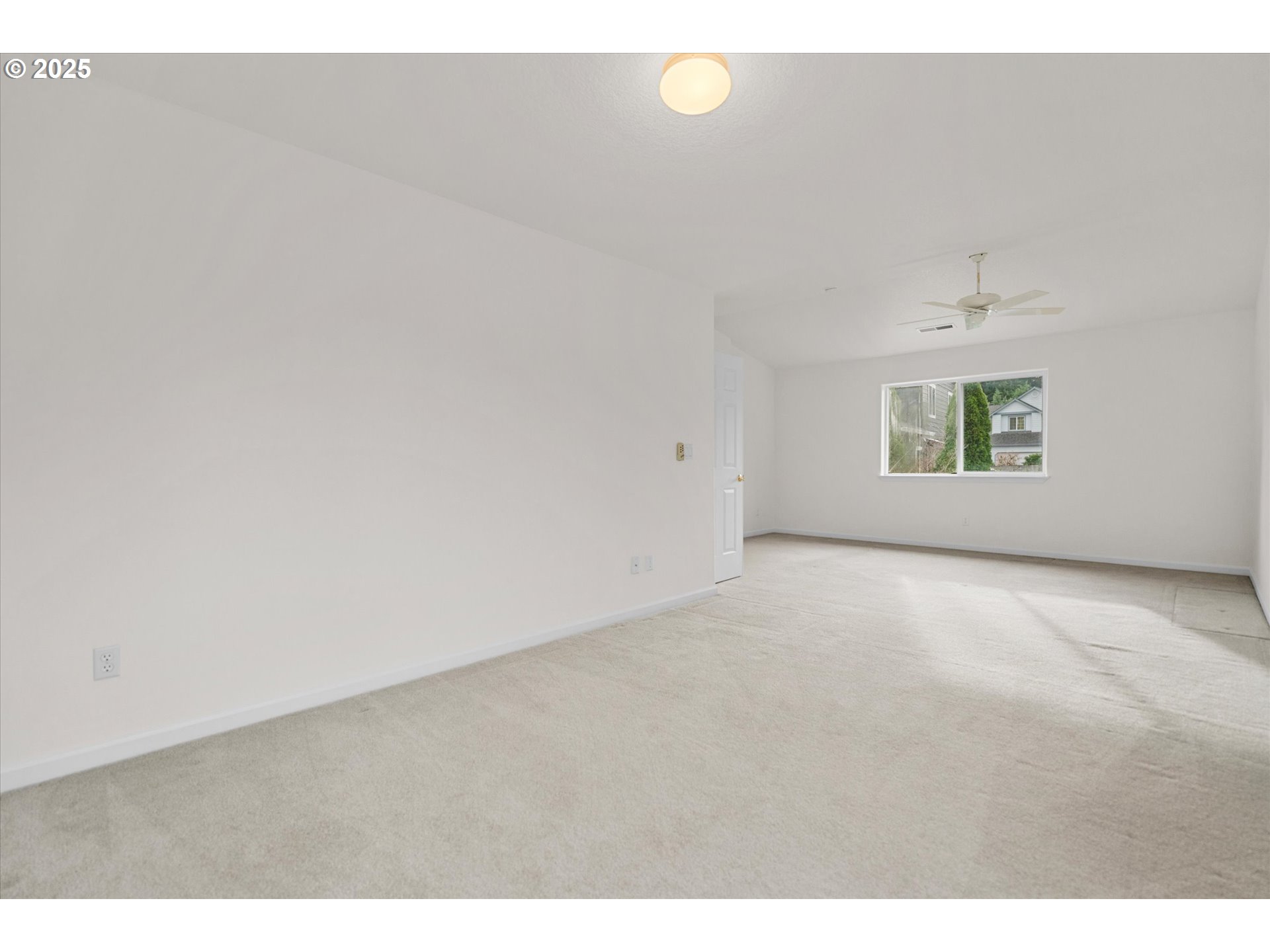 12262 Southwest 114th Terrace Portland, OR 97223 - Photo 23 of 41 a view of an empty room with a window