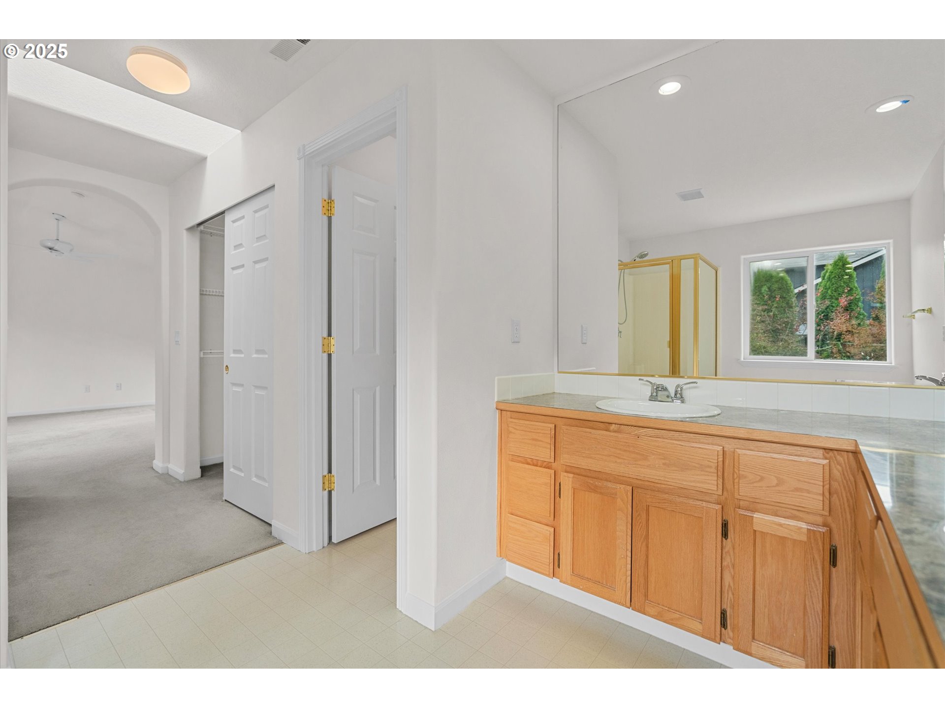 12262 Southwest 114th Terrace Portland, OR 97223 - Photo 27 of 41 a bathroom with a sink a mirror and a bathtub