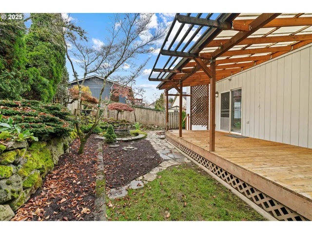 a backyard of a house with outdoor seating