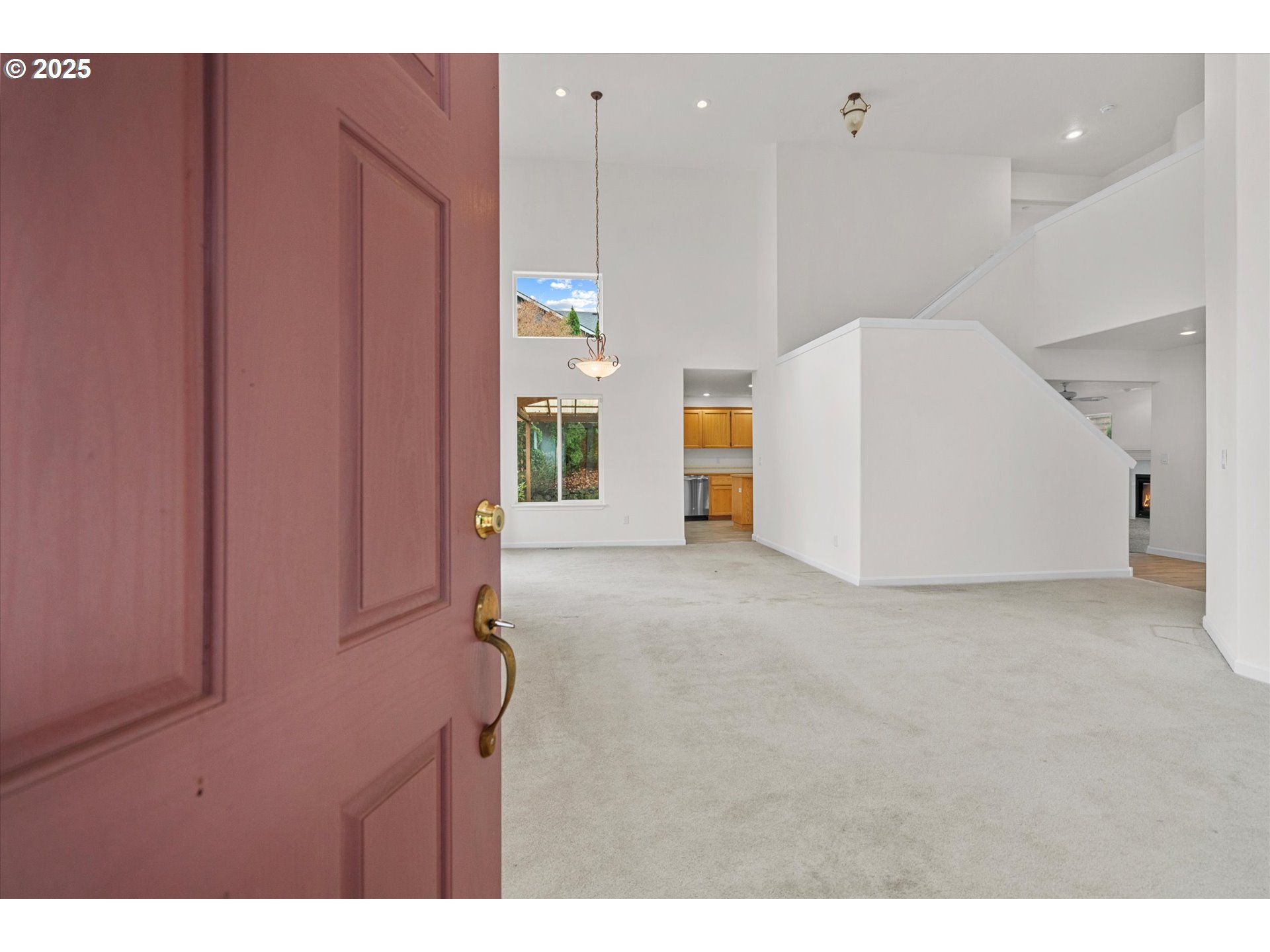 12262 Southwest 114th Terrace Portland, OR 97223 - Photo 8 of 41 a view of an empty room with a kitchen