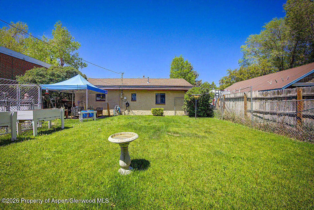 625 Russell Street Craig, CO 81625 - Photo 11 of 35 a front view of a house with garden