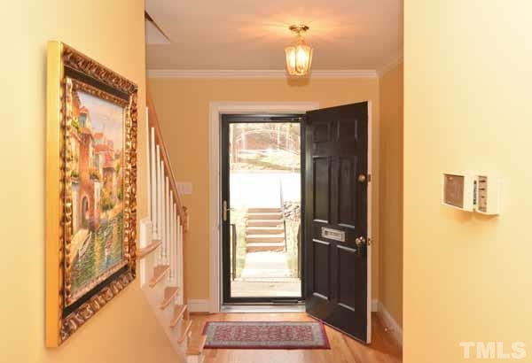 3002 Wycliff Road Raleigh, NC 27607 - Photo 4 of 21 a view of front door with wooden floor