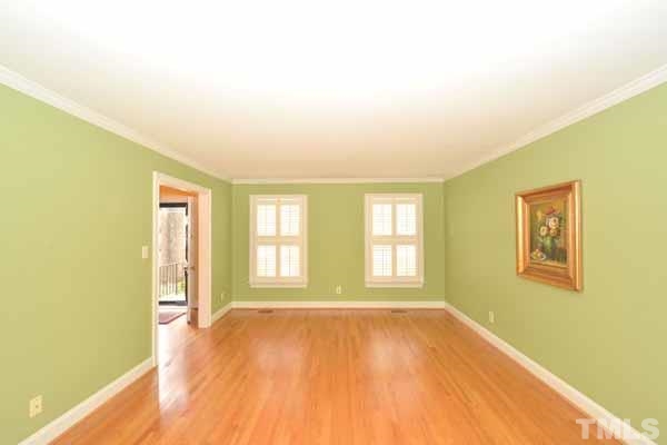 3002 Wycliff Road Raleigh, NC 27607 - Photo 5 of 21 a view of empty room with wooden floor and fan