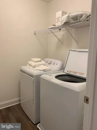 a bathroom with a sink toilet and a mirror