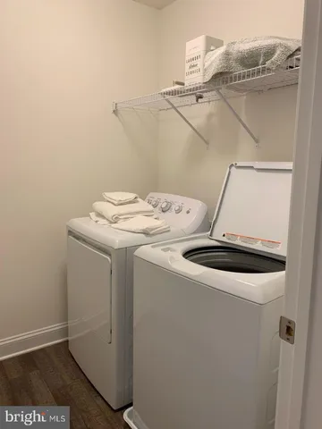 a bathroom with a sink toilet and a mirror